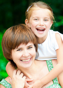 Woman and daughter smiling